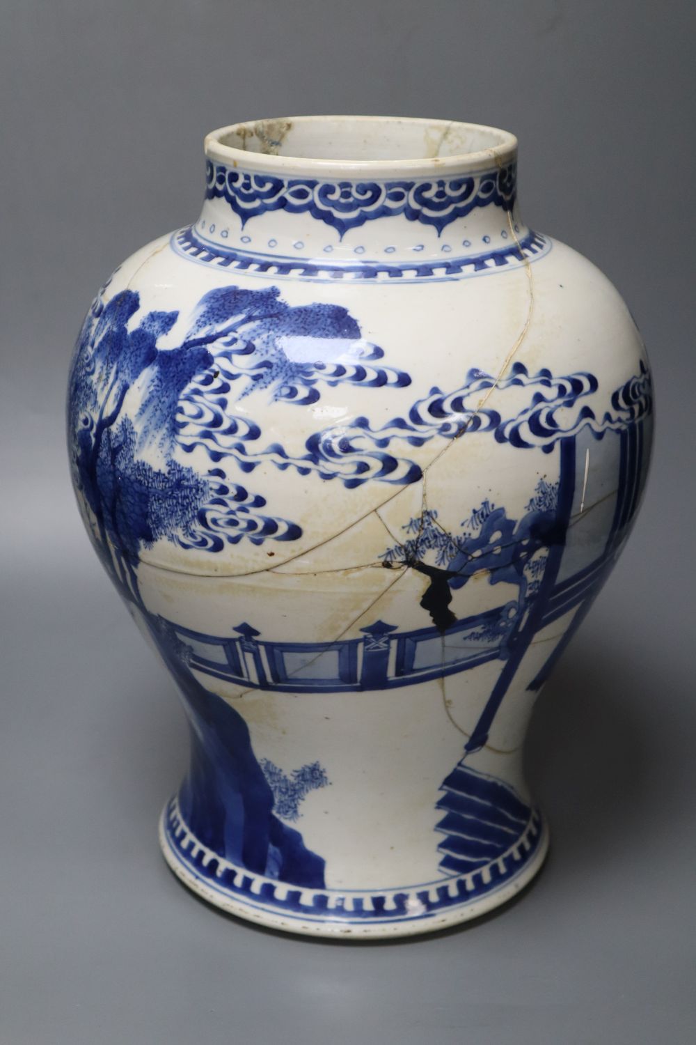 A Chinese Kangxi period blue and white baluster vase, repaired, 35cm